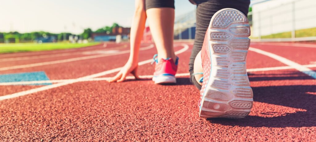 closeup of a runner at starting line track and field