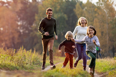 family walking on hiking trail